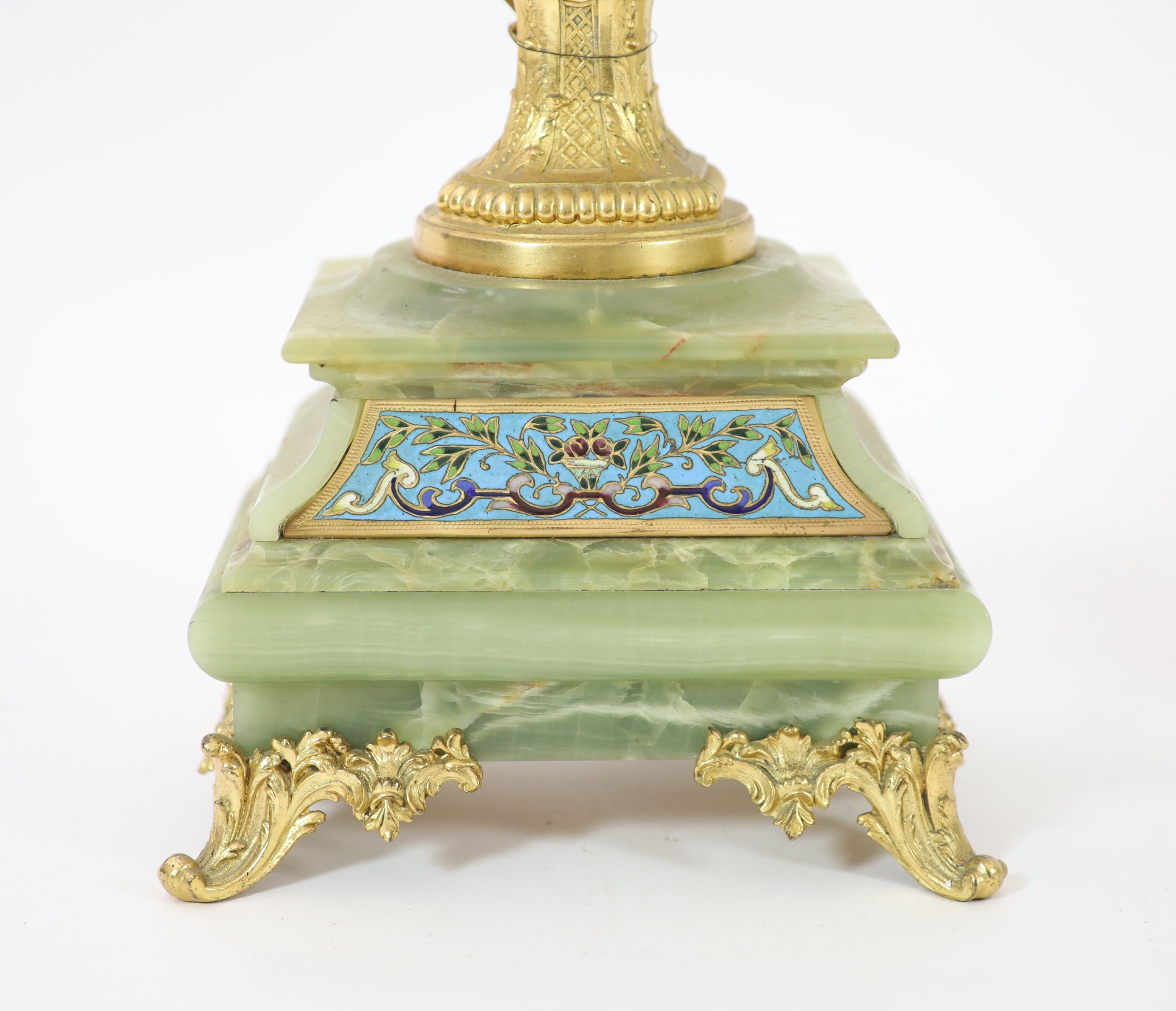 A pair of elaborate gilt metal and green onyx six-light candelabra table lamps on pedestal urn supports incorporating champlevé enamel plaques H 70cm.